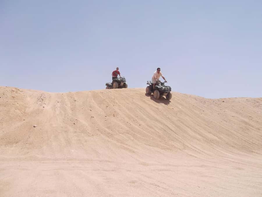 Desert Sunset Quad Bike ATV for 50Km, Oriental Show, Dinner, - Bedouin village, tea, and camel ride