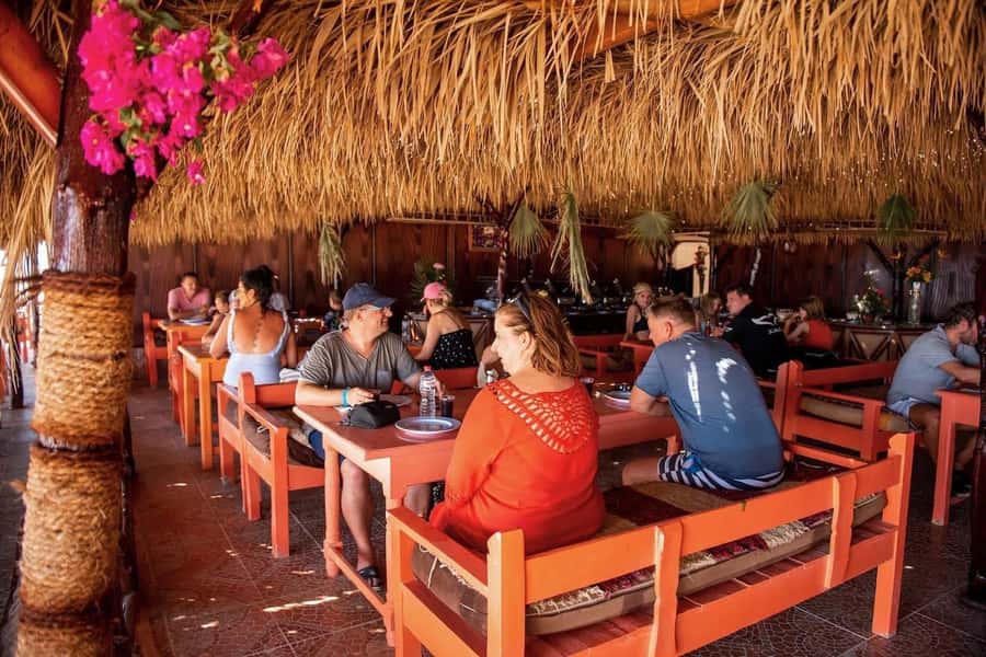 From Hurghada: Paradise Island Snorkeling Cruise with Lunch - Water sports, massage, and the group atmosphere
