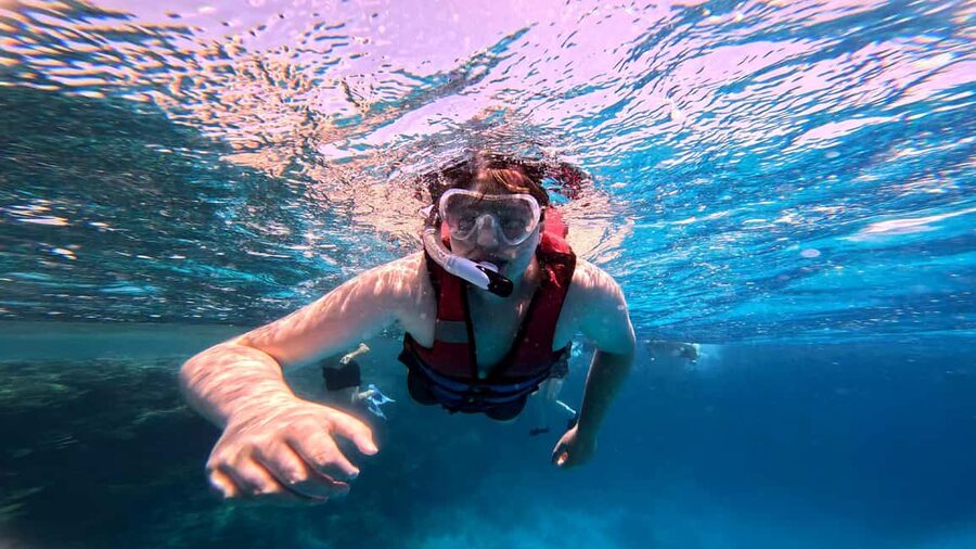 Hurghada: Dolphin Watching Boat Tour with Snorkeling & Lunch - Snorkeling at two Red Sea reefs