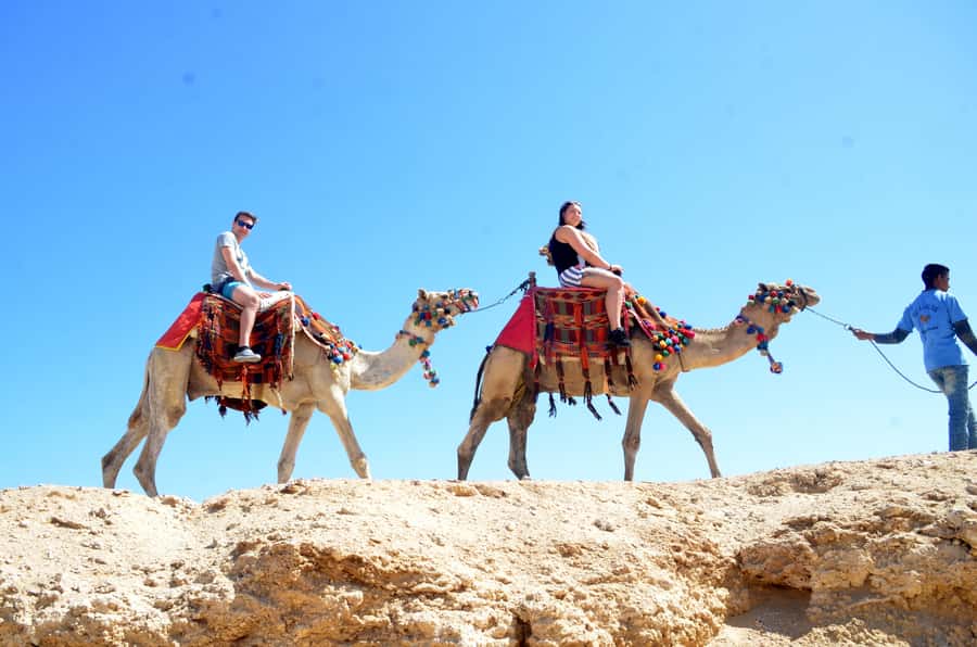 Hurghada: Sea & Desert Camel Ride w/Dinner, Show, Stargazing - Riding from desert plains toward the Red Sea