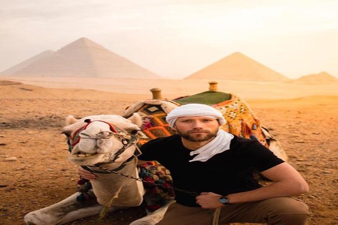 Private Experienced Tour for Camel ride during the sunset with Local Bedouin Dinner - A sunset view of Giza from camelback