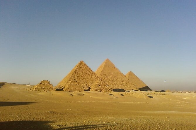 Pyramids of giza ,Sphinx,riding camel and driving a quad bick ATV. - The camel ride and the classic pyramid photograph