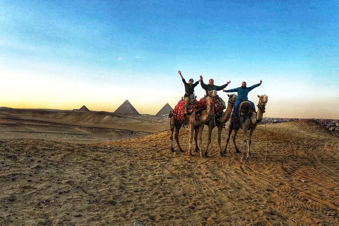 sunset at Giza pyramids by camels - Sunset views of the Giza Pyramids