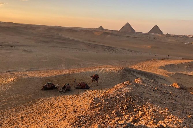sunset at Giza pyramids by camels - Leaving Cairo for the Giza desert