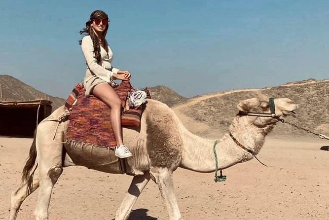 The Super Desert Safari Jeep Tour from Hurghada - Camel riding with the mountains in view