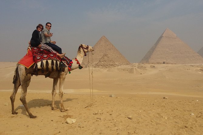 Unusual Desert Safari Tour Around Giza Pyramids During Sunset With Barbecue. - Quad biking with Khufu, Khafre, and Menkaure in view